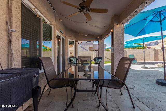 view of patio featuring ceiling fan