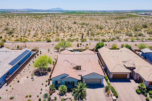 birds eye view of property with a mountain view