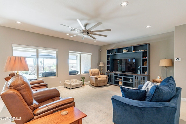 living room with ceiling fan, visible vents, baseboards, and recessed lighting