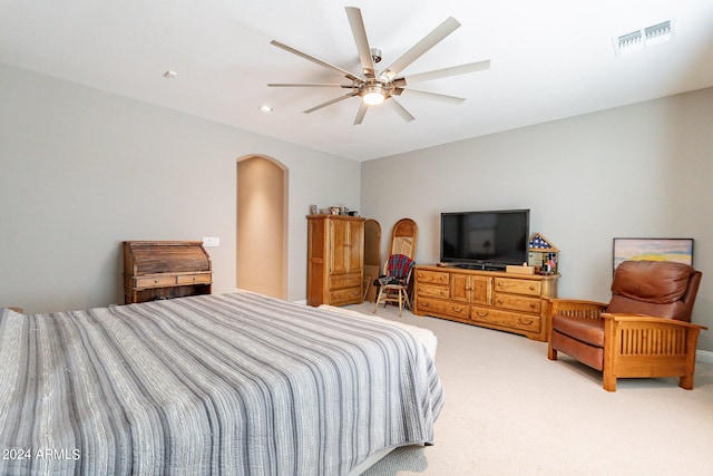 bedroom featuring ceiling fan and light carpet