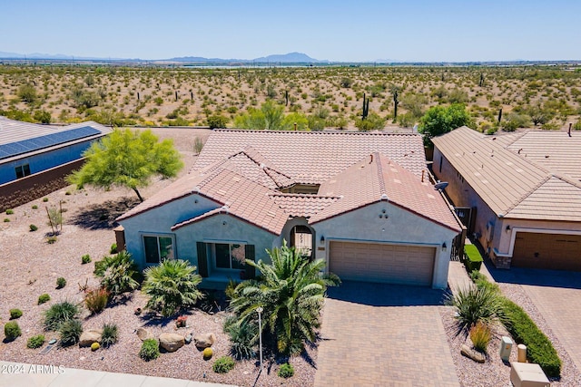 bird's eye view with a mountain view and view of desert