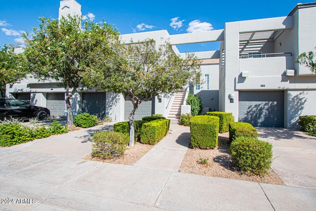 multi unit property featuring a garage