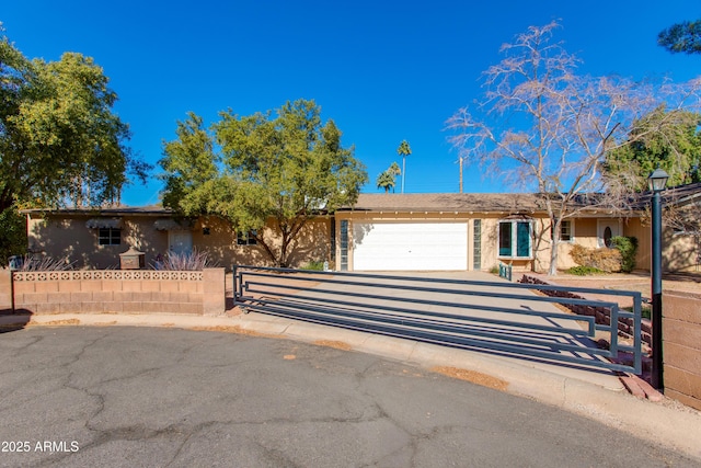 single story home with a garage