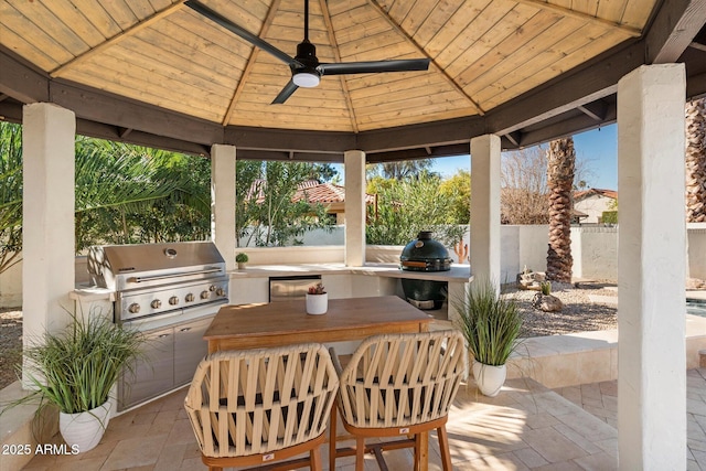 9915 E Cinnabar Ave, Scottsdale, AZ 85258 - view of patio featuring a gazebo, grilling area, fence, an outdoor kitchen, and ceiling fan