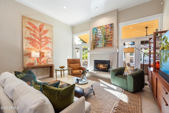 9915 E Cinnabar Ave, Scottsdale, AZ 85258 - living area with ornamental molding, a glass covered fireplace, and recessed lighting