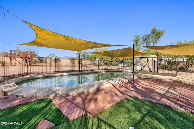 view of swimming pool featuring a patio area