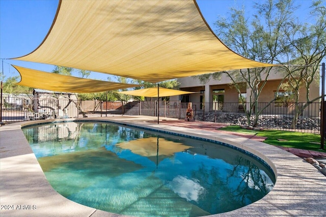 view of swimming pool with a patio