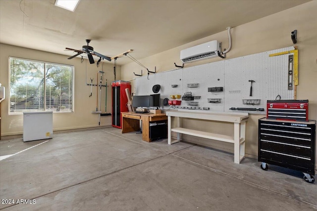 garage featuring a workshop area, ceiling fan, and a wall mounted air conditioner