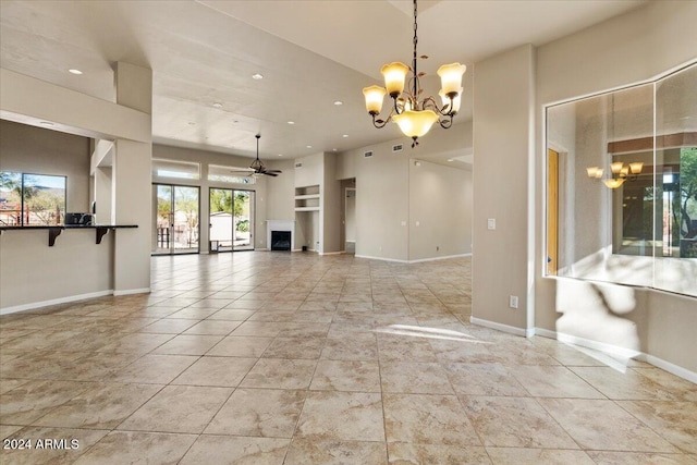 36908 N 19th St, Phoenix, AZ 85086 - unfurnished living room featuring a chandelier, a ceiling fan, baseboards, and recessed lighting