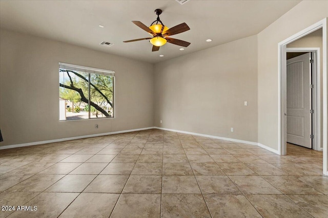 spare room with ceiling fan