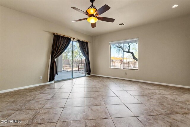 36908 N 19th St, Phoenix, AZ 85086 - empty room with baseboards, light tile patterned floors, and a ceiling fan