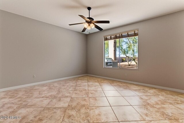 36908 N 19th St, Phoenix, AZ 85086 - unfurnished room featuring ceiling fan, baseboards, and light tile patterned flooring