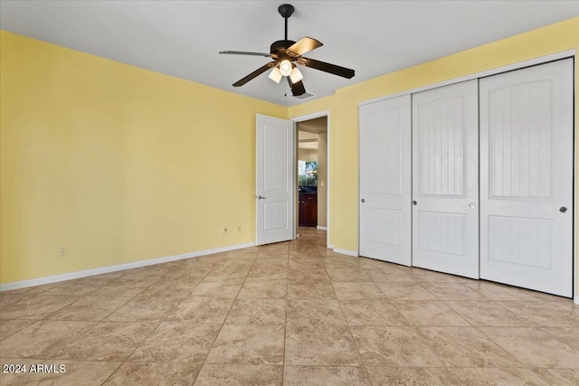 unfurnished bedroom with a closet and ceiling fan