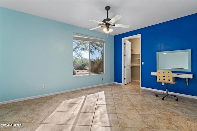 unfurnished office featuring ceiling fan