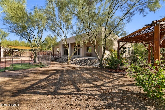 exterior space with a pergola