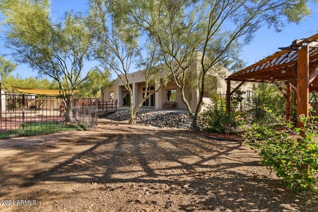 36908 N 19th St, Phoenix, AZ 85086 - rear view of house featuring stucco siding and a pergola