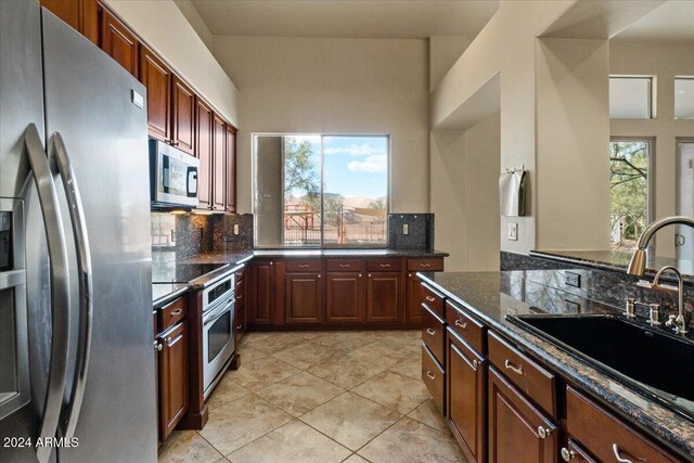 36908 N 19th St, Phoenix, AZ 85086 - kitchen with appliances with stainless steel finishes, a sink, tasteful backsplash, and light tile patterned floors