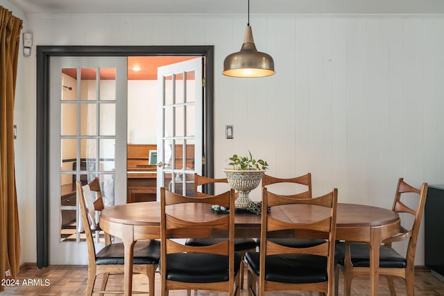 dining area with parquet floors