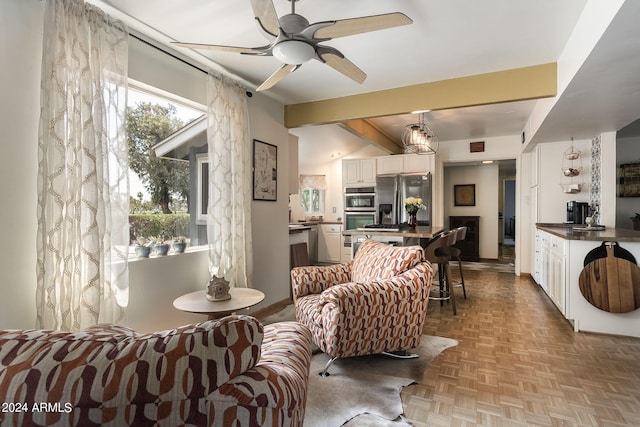 living room featuring ceiling fan, beamed ceiling, and light parquet floors