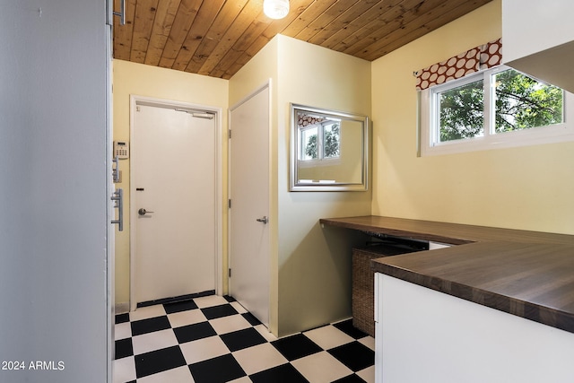 interior space featuring wooden ceiling