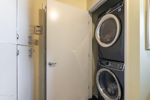 laundry area featuring stacked washer and dryer