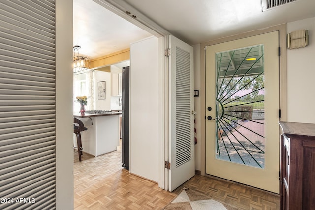 entrance foyer with light parquet floors