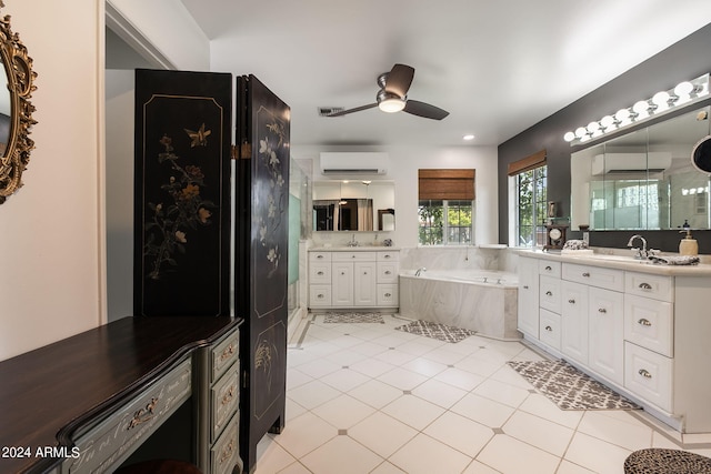 bathroom featuring tiled bath, a wall unit AC, ceiling fan, tile patterned flooring, and vanity