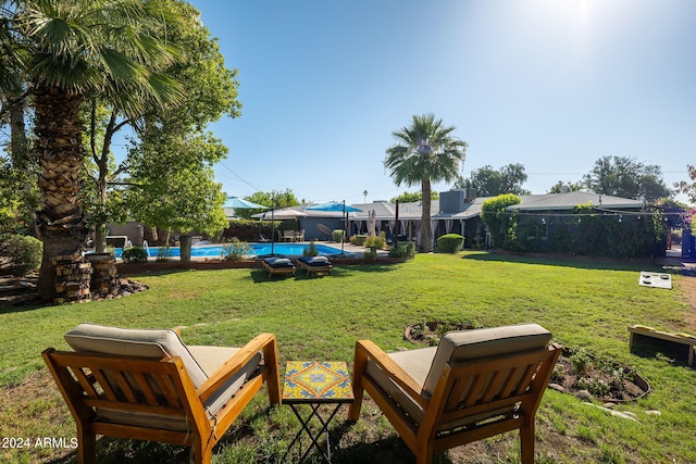 view of yard with a pool