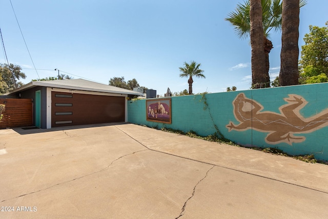 view of side of home with a garage