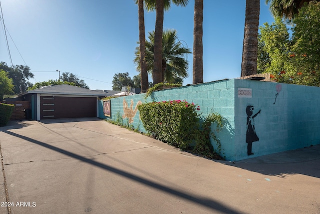 view of side of home featuring a garage