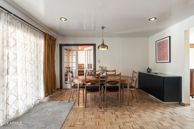 dining space with light parquet floors