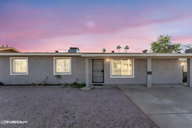 ranch-style home with stucco siding