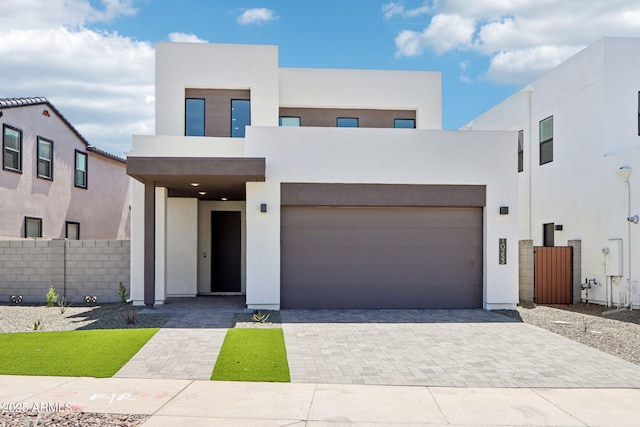 10253 E Ursula Ave, Mesa, AZ 85212 - modern home featuring stucco siding, decorative driveway, and a garage