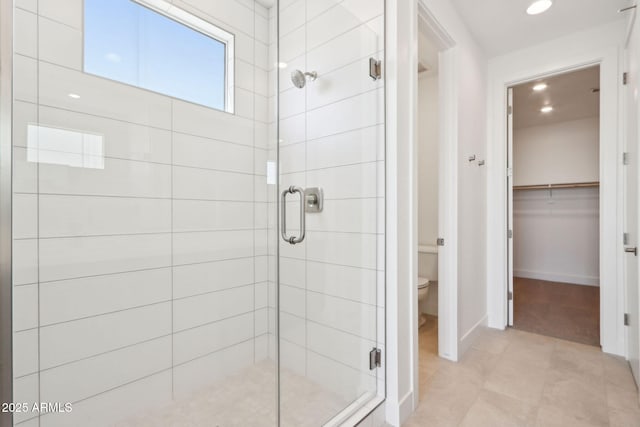 10253 E Ursula Ave, Mesa, AZ 85212 - full bath with a stall shower, a walk in closet, toilet, recessed lighting, and baseboards