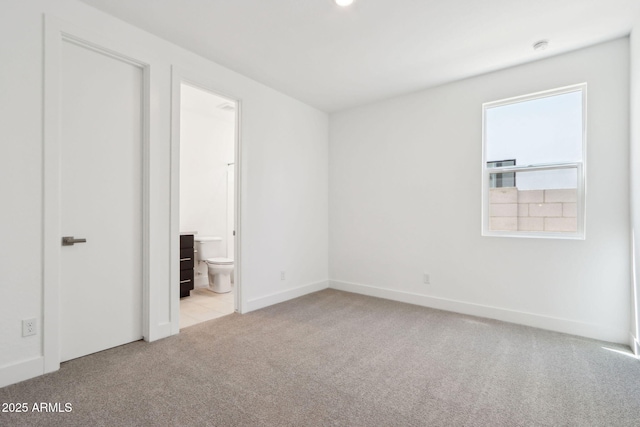 10253 E Ursula Ave, Mesa, AZ 85212 - unfurnished bedroom with carpet floors, baseboards, and ensuite bathroom