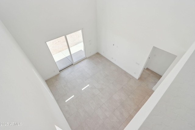 10253 E Ursula Ave, Mesa, AZ 85212 - unfurnished room featuring a towering ceiling