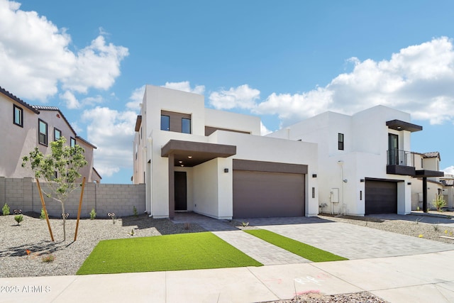 10253 E Ursula Ave, Mesa, AZ 85212 - contemporary home featuring stucco siding, driveway, a balcony, and an attached garage