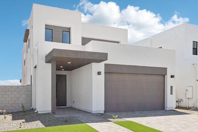 10253 E Ursula Ave, Mesa, AZ 85212 - contemporary home with stucco siding, an attached garage, and driveway