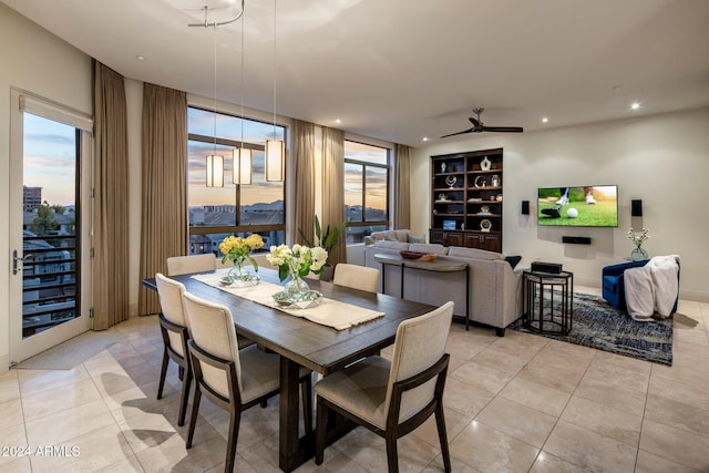 dining area with ceiling fan, a healthy amount of sunlight, light tile patterned floors, and built in shelves