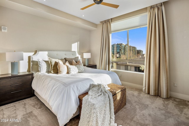 carpeted bedroom with ceiling fan