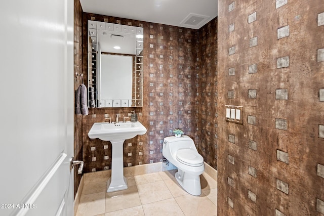 bathroom with tile patterned flooring and toilet