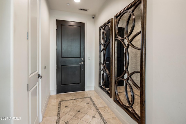 doorway featuring light tile patterned floors