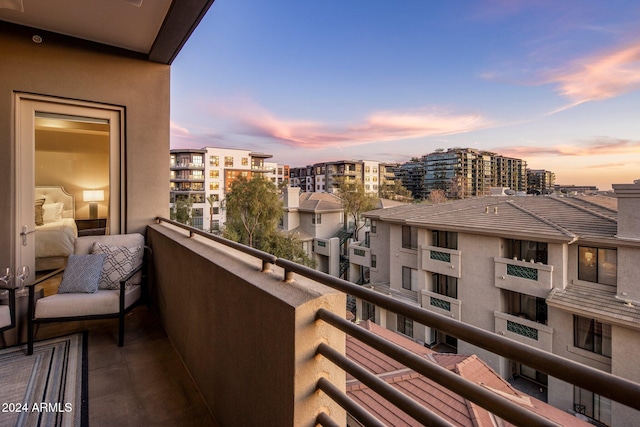 view of balcony at dusk