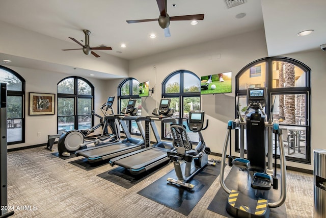 exercise room with carpet flooring and ceiling fan