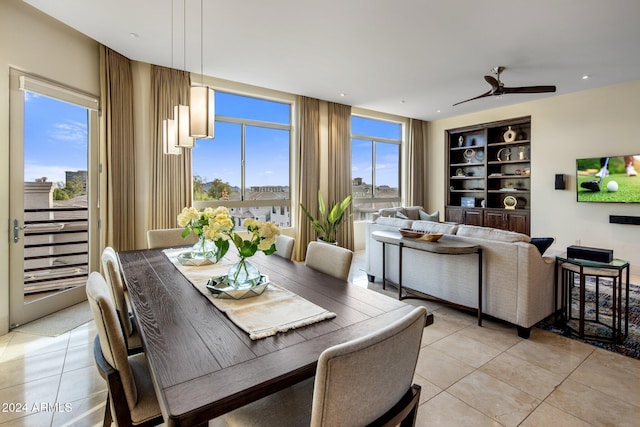 dining area with light tile patterned flooring and ceiling fan