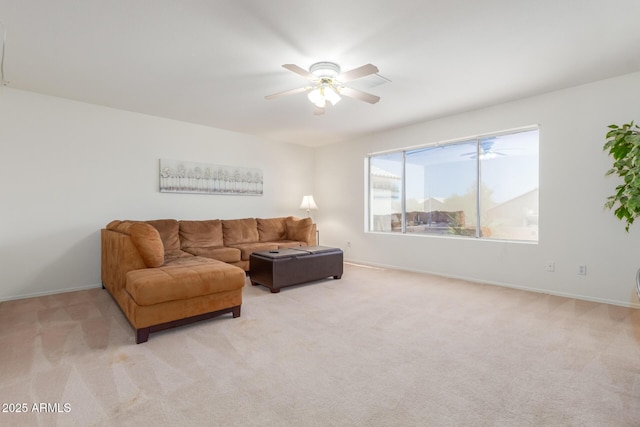 carpeted living room with ceiling fan