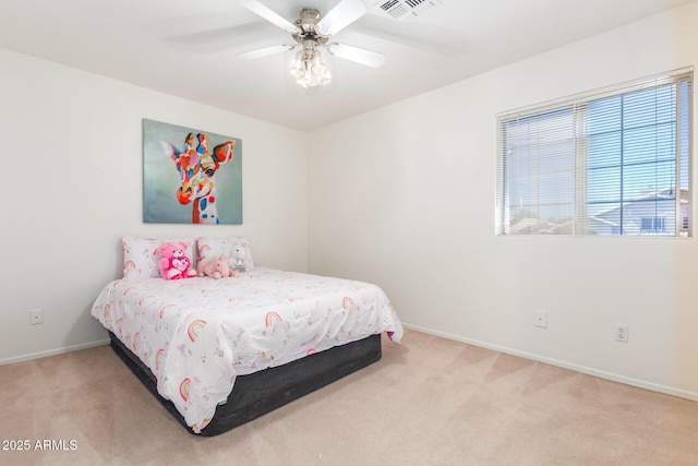 bedroom with ceiling fan and light carpet