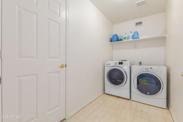 laundry area featuring washer and clothes dryer