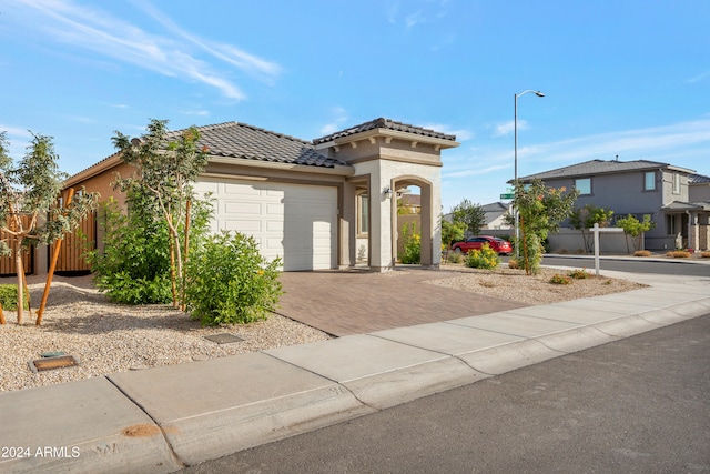 view of front of property with a garage