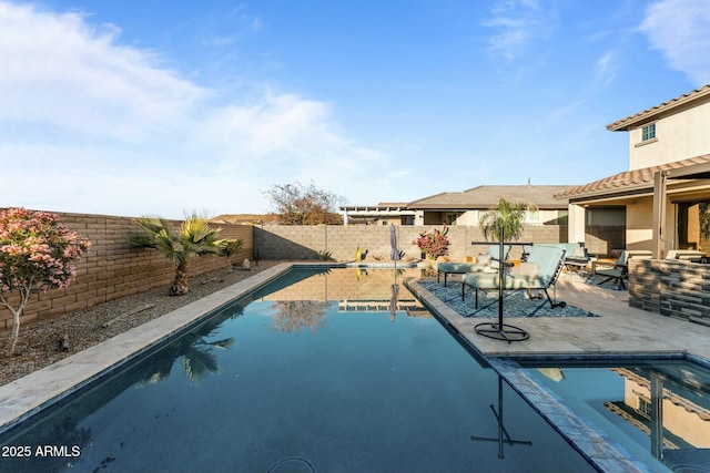 view of swimming pool featuring a patio area